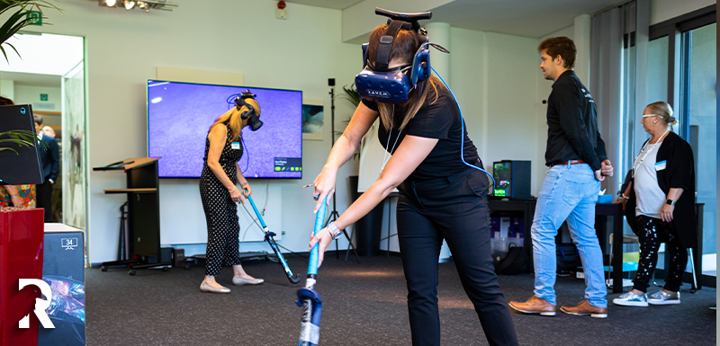 Two women trying VR Hokcey