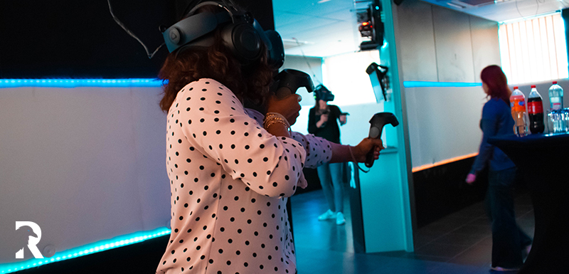 Woman playing bowshooting on teambuilding